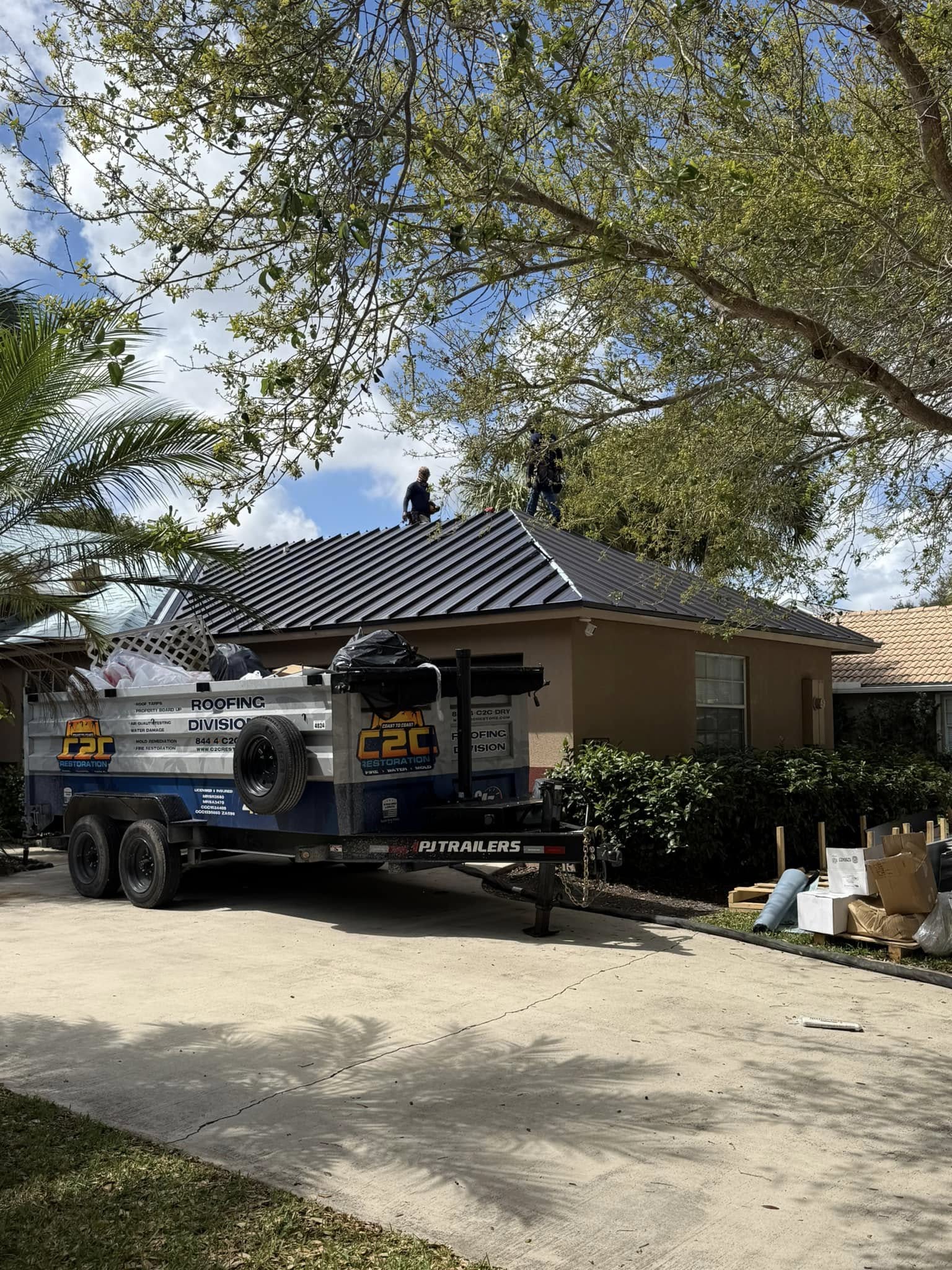 C2C crew installing a standing seam metal roof